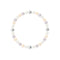 un bracelet de perles blanches et roses