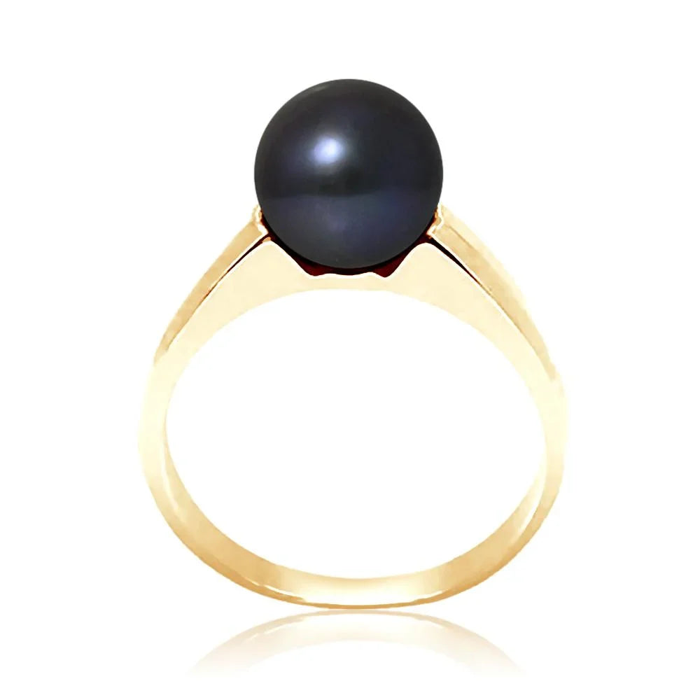 Bague dorée avec une perle noire