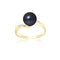 une bague en perles noires et diamants