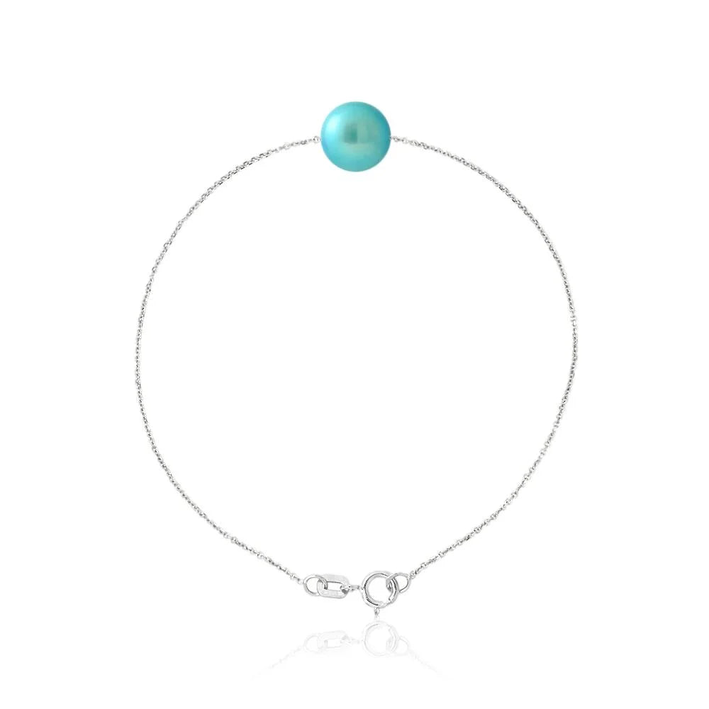 un bracelet de couleur turquoise avec une boule en argent