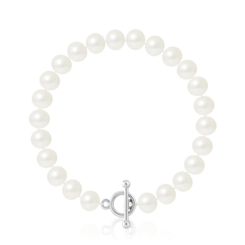 un bracelet en perles blanches avec un fermoir en argent