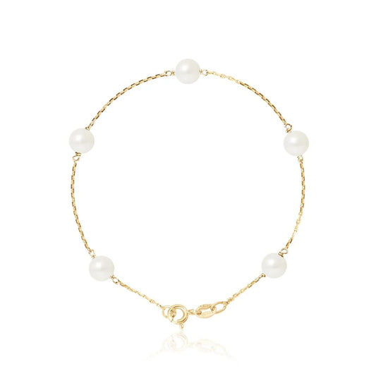 un bracelet en or avec des perles blanches et un fermoir en or