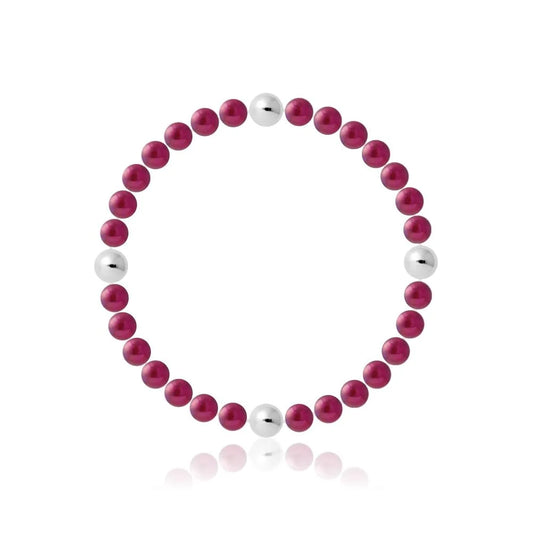 un bracelet en perles rouges et blanches