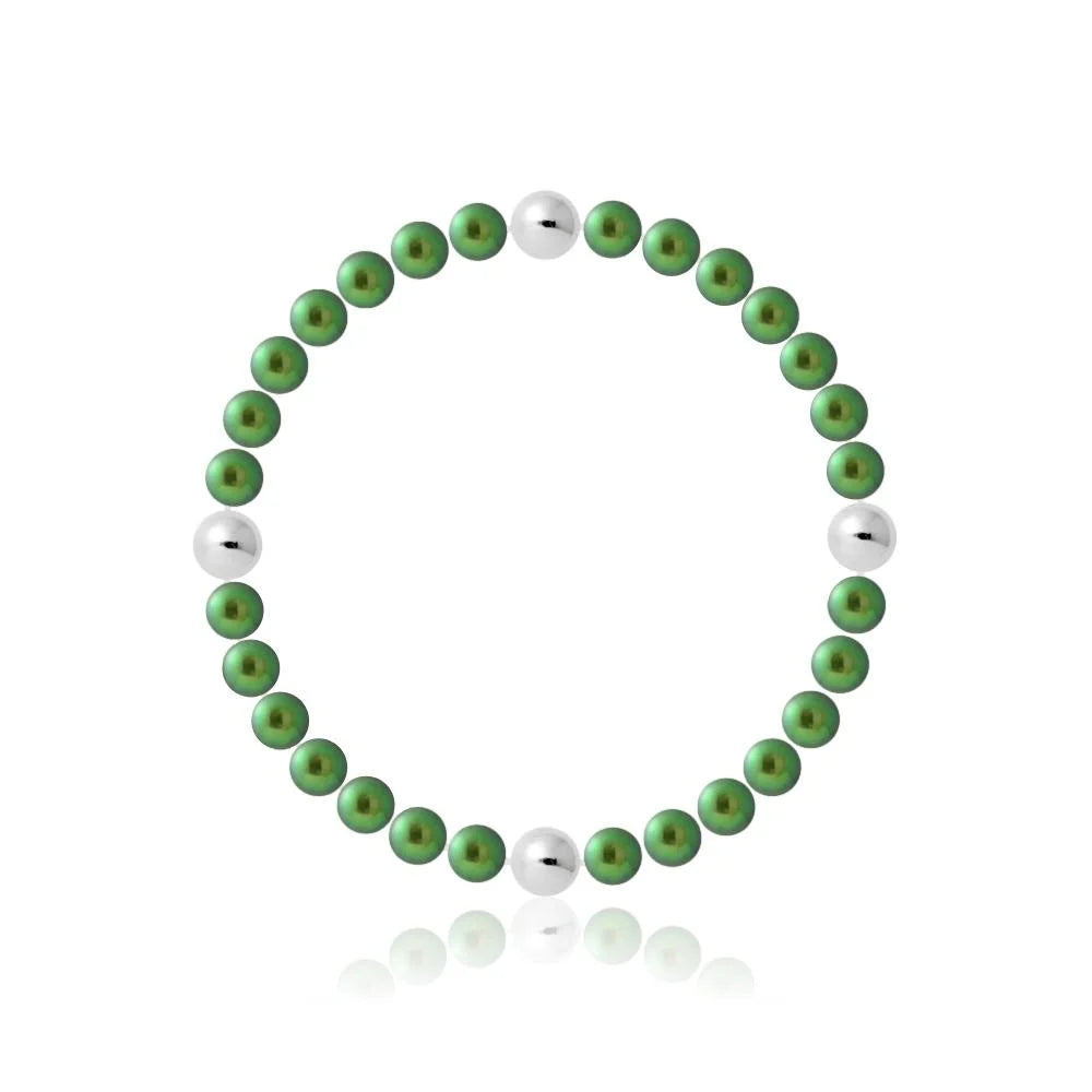 un bracelet vert et blanc avec une perle