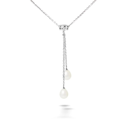 un pendentif en perles blanches et diamants