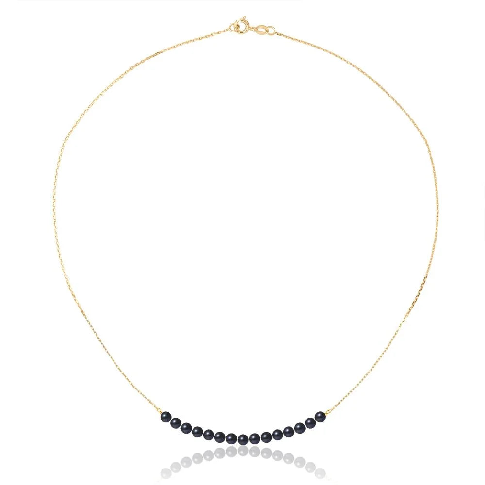 un collier de perles noires avec une chaîne en or