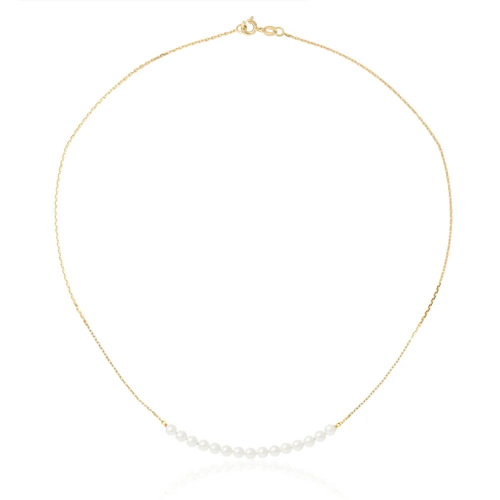 un collier en or avec une seule perle