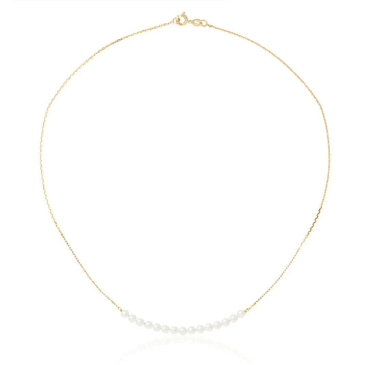 un collier en or avec une seule perle